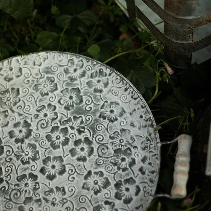 Round wrought iron storage tray in European style, shown in two available sizes for home organisation.