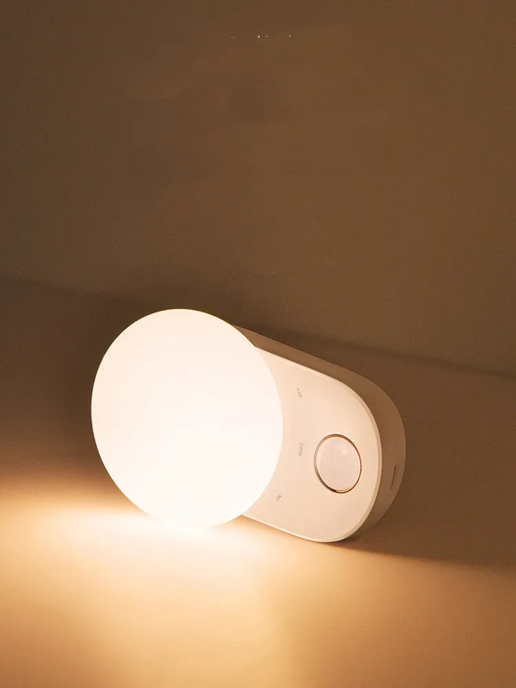 White Baseus rechargeable motion sensor bedside night light with USB port.