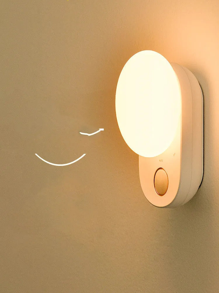 White Baseus rechargeable motion sensor bedside night light with USB port.