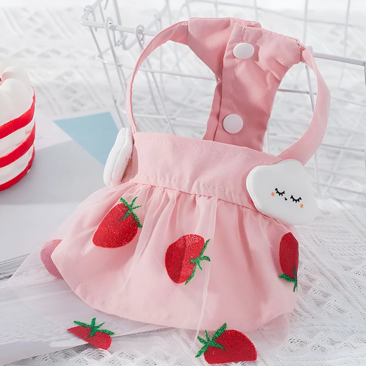 Pink strawberry princess dress for dog made from woven cloth on model
