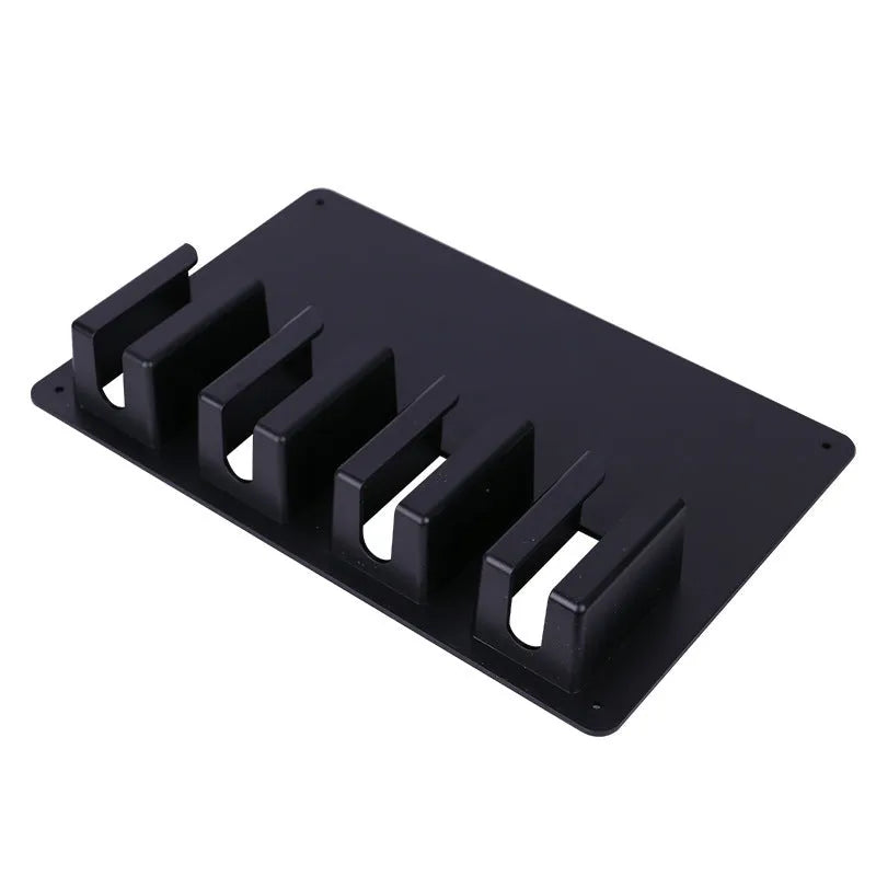 Black plastic wall-mounted storage box holding four electric hair clippers with screws included for installation