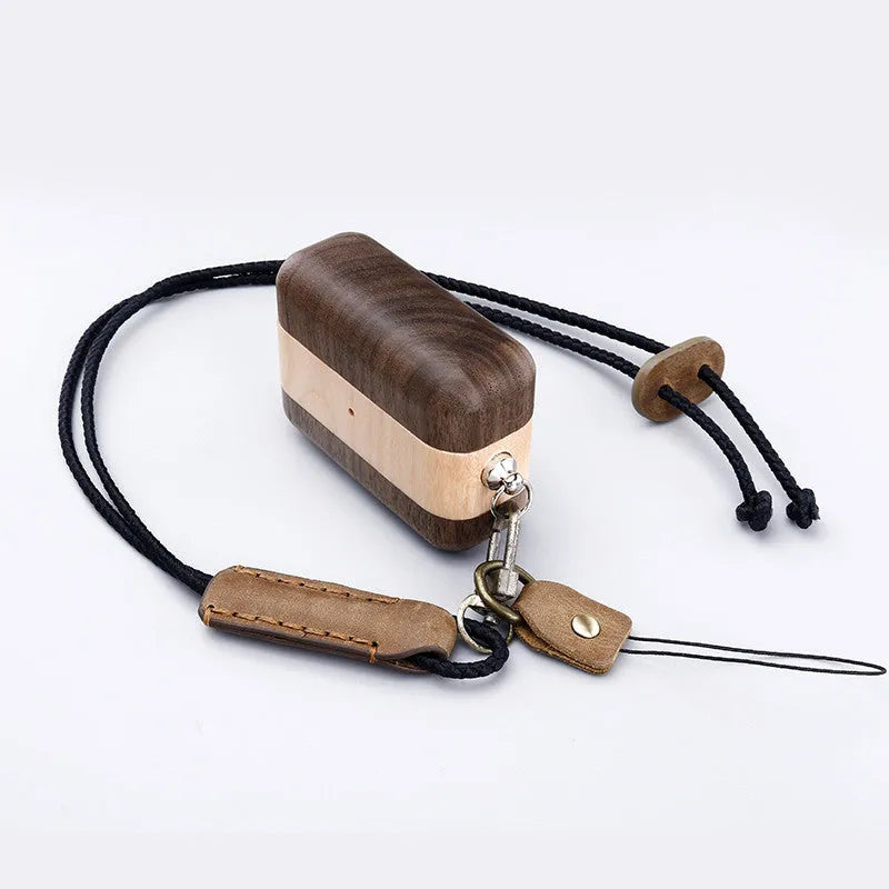 Solid wood Bluetooth earphone sleeve case in bamboo, cherry, huali, maple or walnut with lanyard option.