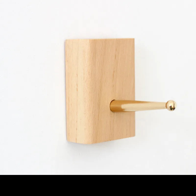 Beech wood wall hook with brass hook component in five different shapes for screw-mounting to walls