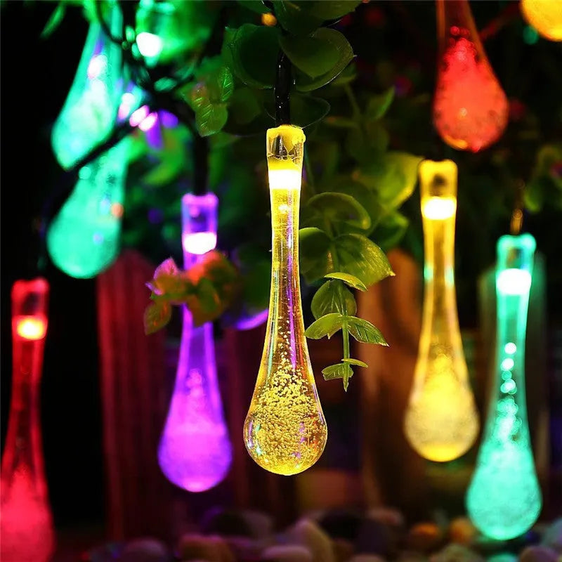 30 LED solar-powered water drop shaped string lights on a 6.5m cable for outdoor garden use.