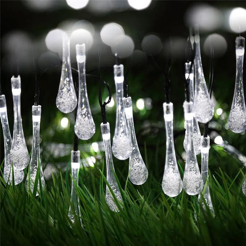 30 LED solar-powered water drop shaped string lights on a 6.5m cable for outdoor garden use.