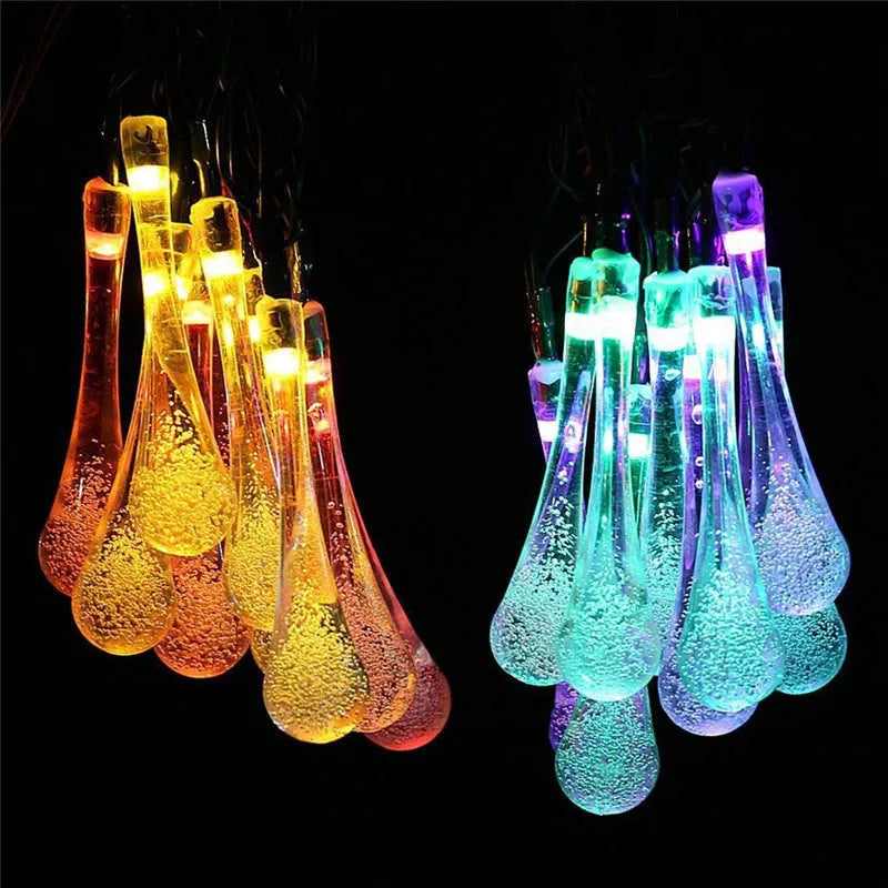 30 LED solar-powered water drop shaped string lights on a 6.5m cable for outdoor garden use.