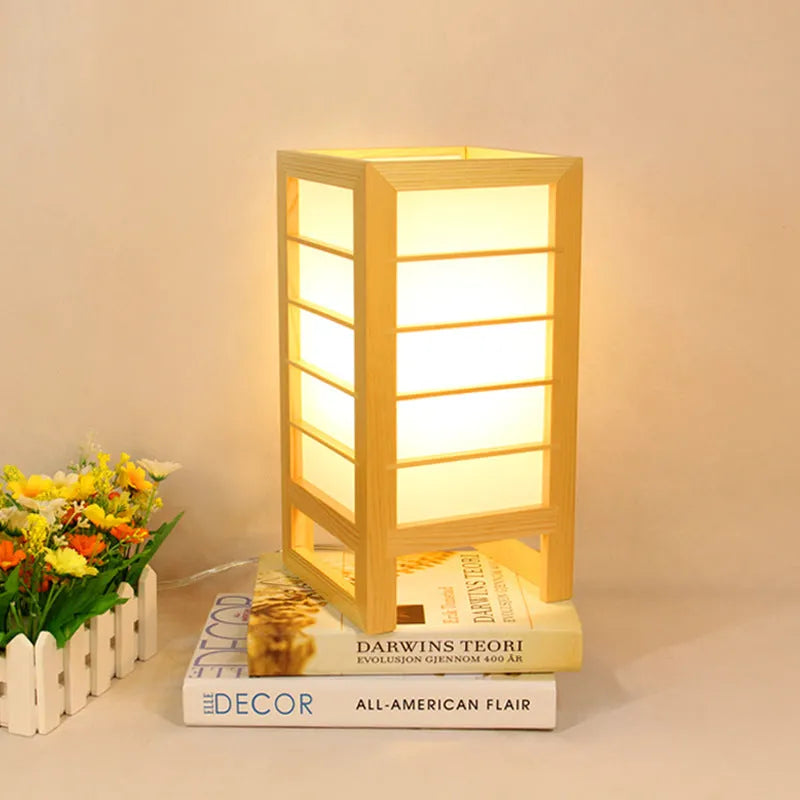 Simple Korean-style bedside table lamp with a solid bamboo wood base on a nightstand.