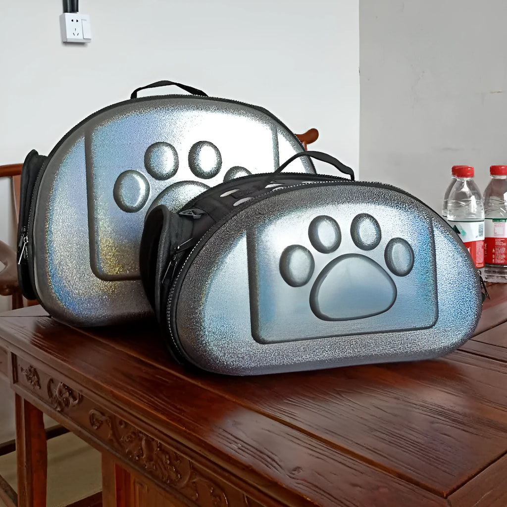 Black folding pet carrier bag with anti-tear mesh door and ventilation holes, for cats and small dogs.
