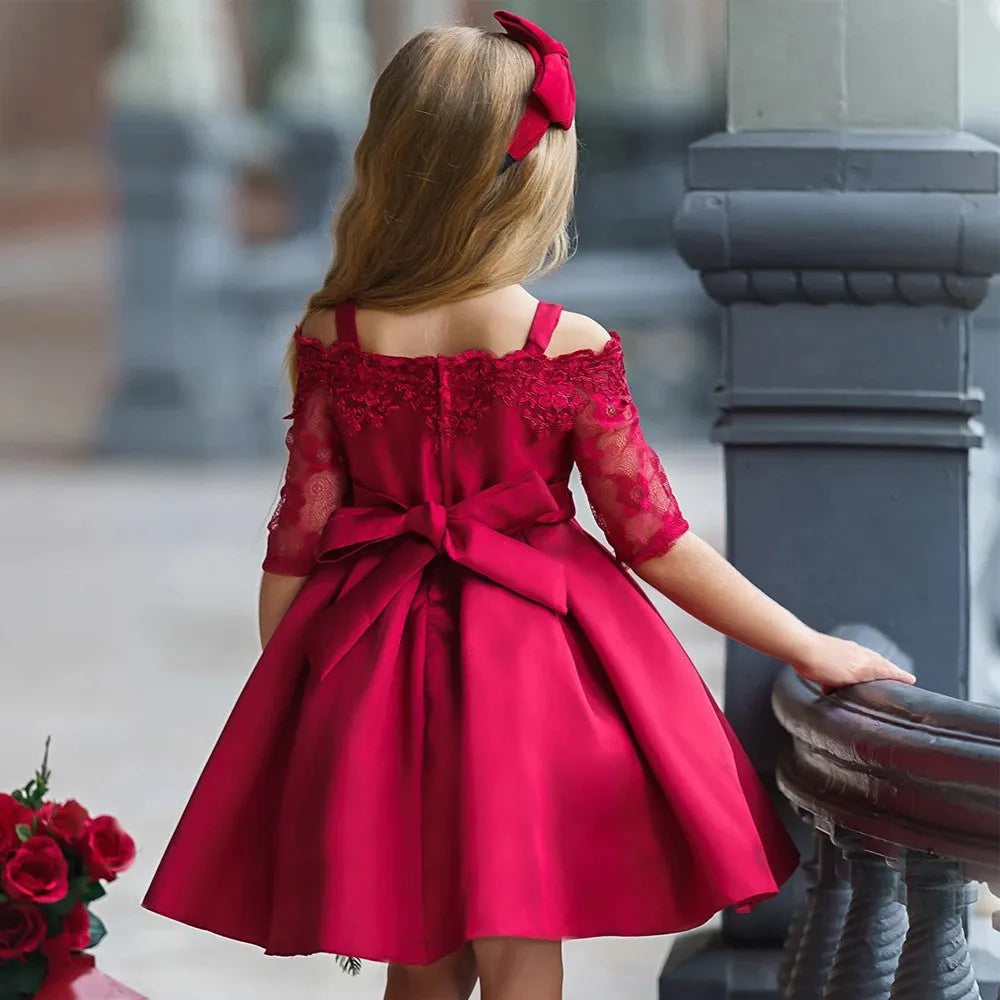 A girls' lace-trimmed dress set comprising a top and skirt, shown in one of the available colours.