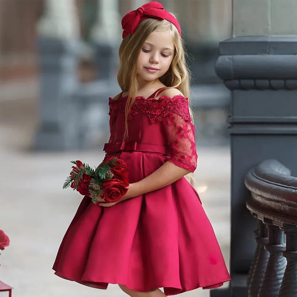 A girls' lace-trimmed dress set comprising a top and skirt, shown in one of the available colours.