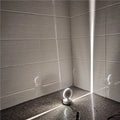Modern aluminium corridor wall spotlight bar lamp with coloured LED options on a wall.