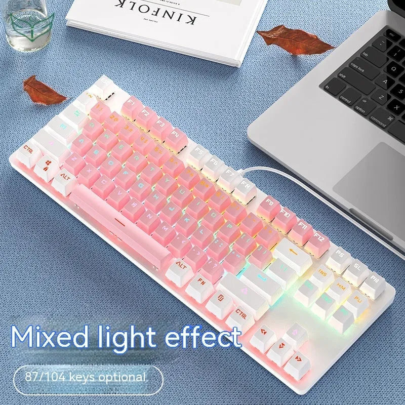 Red and black 87-key compact mechanical keyboard with green axis switches on a desk, shown with blue mixed light backlight