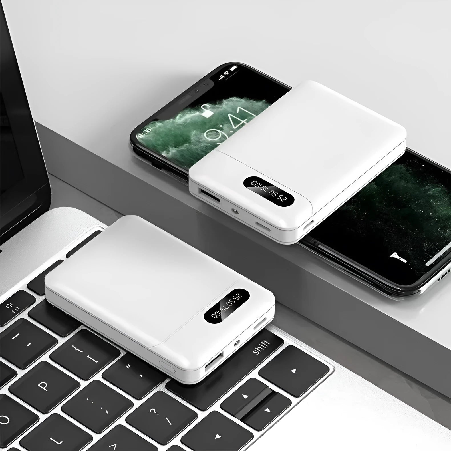 Black and white portable power bank showing USB ports and compact rectangular design