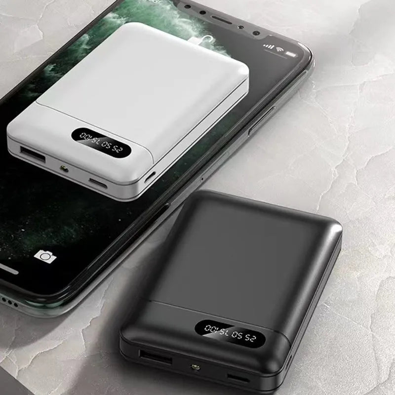 Black and white portable power bank showing USB ports and compact rectangular design