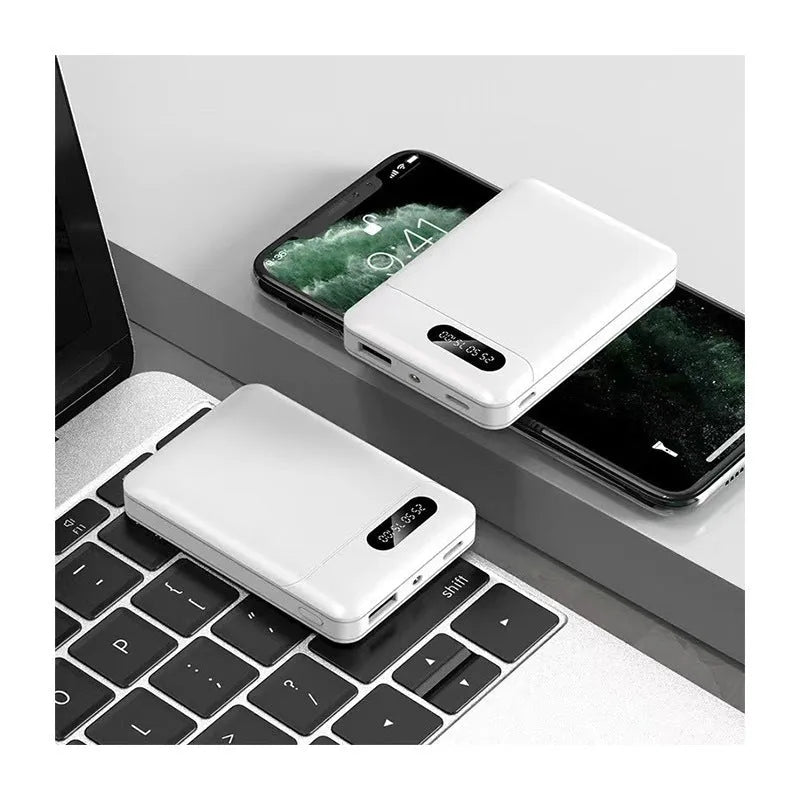 Black and white portable power bank showing USB ports and compact rectangular design
