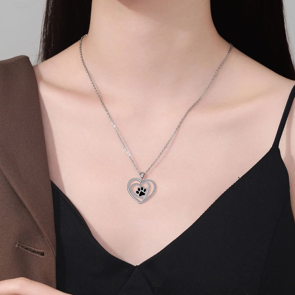 Women's copper dog paw heart pendant necklace on cross chain, electroplated finish.