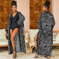 Printed beach cover-up in black white line design on a woman over a bikini, loose fit rayon-cotton tunic