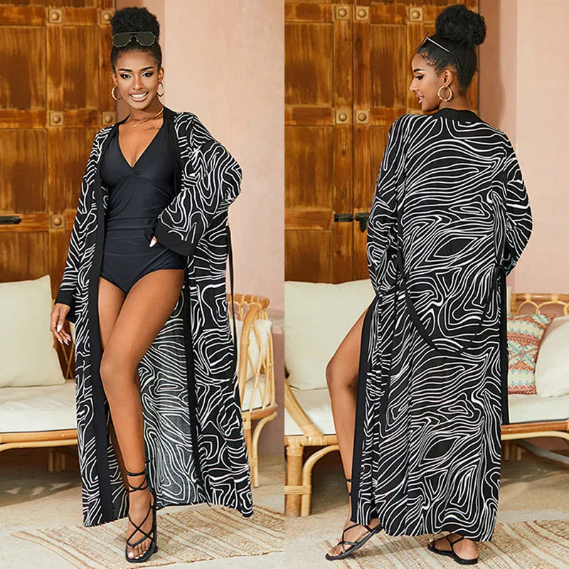 Printed beach cover-up in black white line design on a woman over a bikini, loose fit rayon-cotton tunic