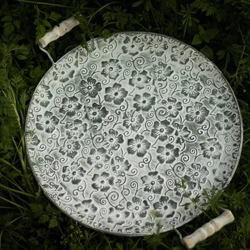 Round wrought iron storage tray in European style, shown in two available sizes for home organisation.