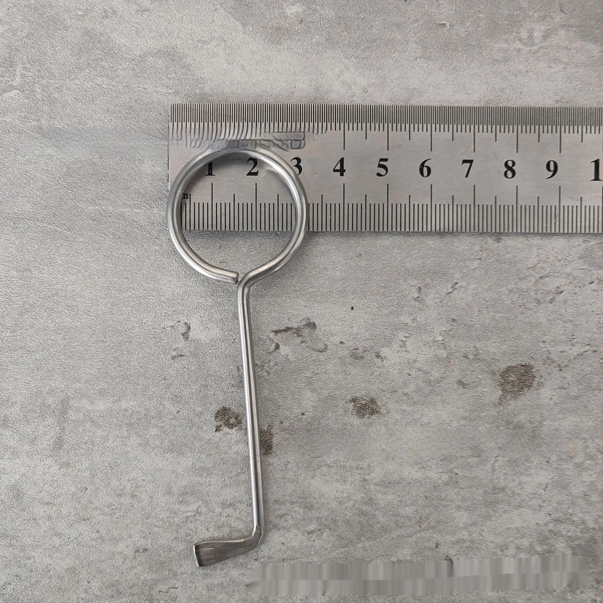 Two alloy wrench tools from a portable household tool set on a plain background.