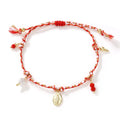 Close-up of a hand-woven colourful braided rope bracelet for women with an integrated fabric strap tag.