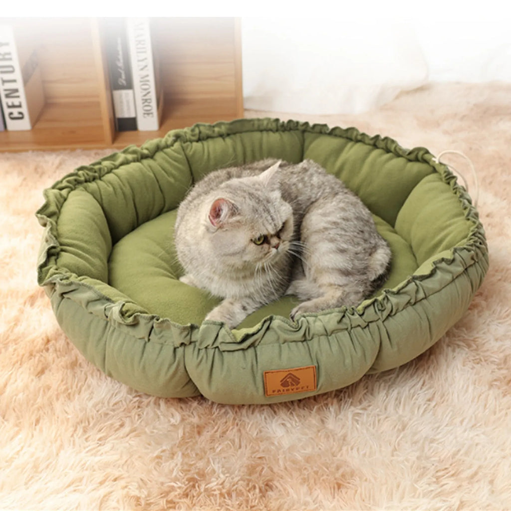 Grey and green reversible donut cat bed shown flat and in raised donut shape