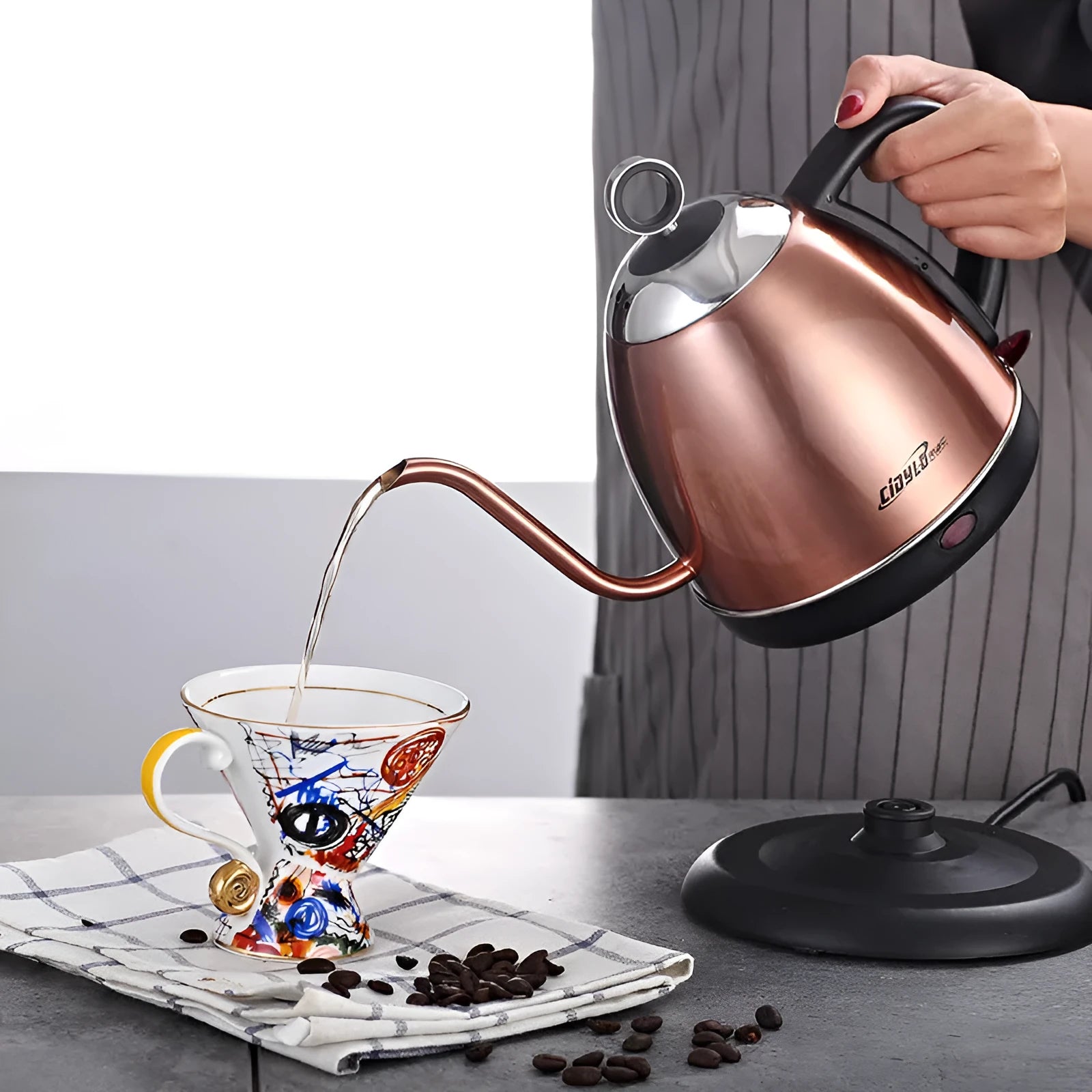 Gold stainless steel kettle with touch controls and 1L capacity marking