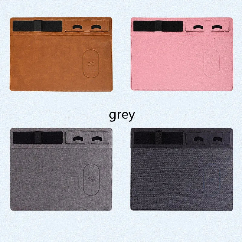 Pink wireless charging mouse pad with integrated phone holder on a desk