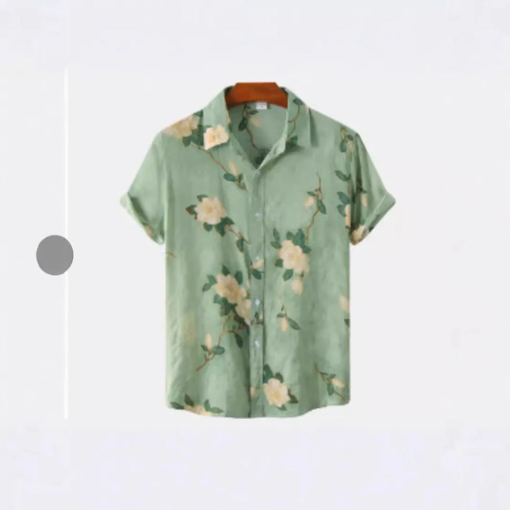 Man wearing a short sleeve Hawaiian shirt with a colourful floral print pattern.