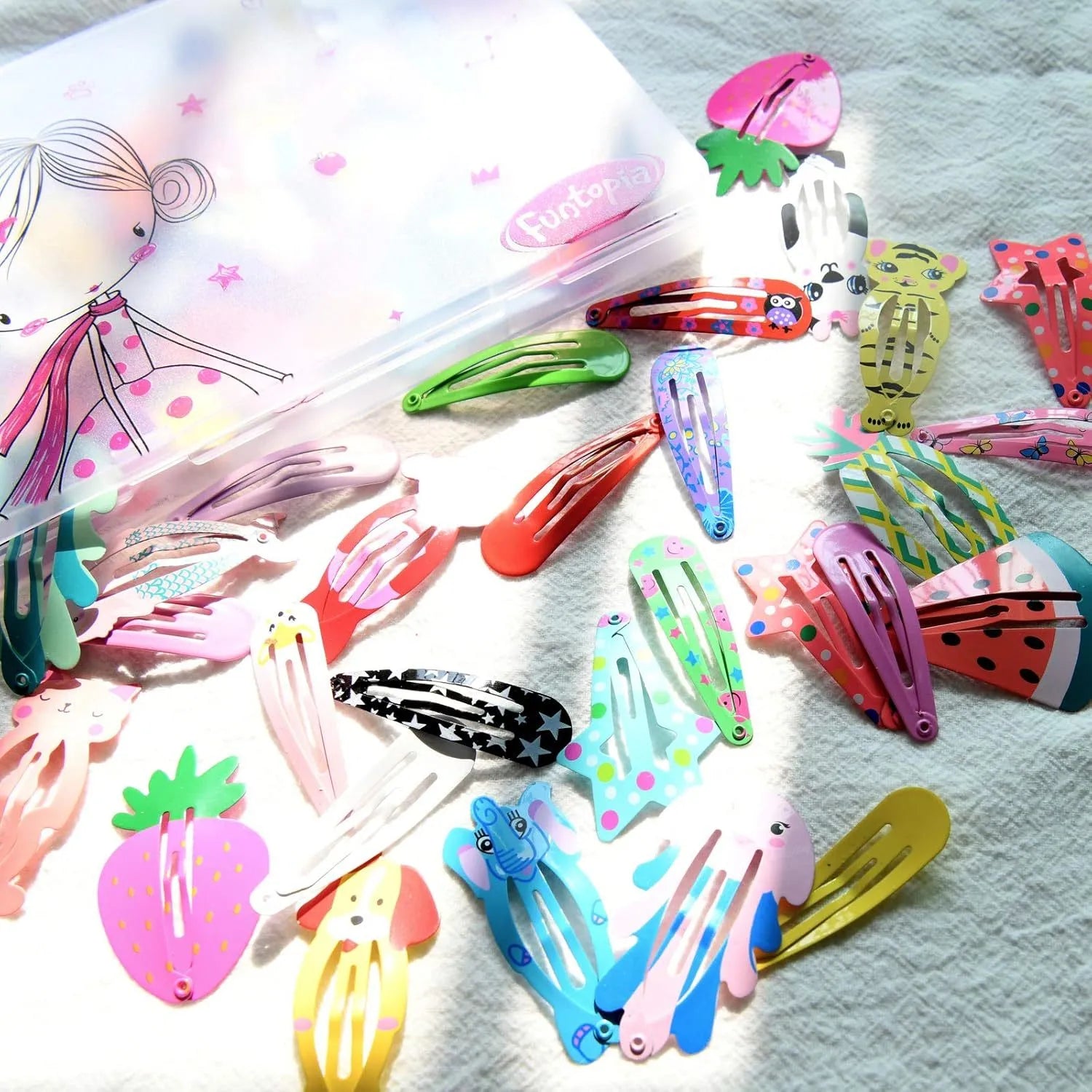 Assortment of 100 metal snap hair clips in animal, fruit, crown, star and flower designs