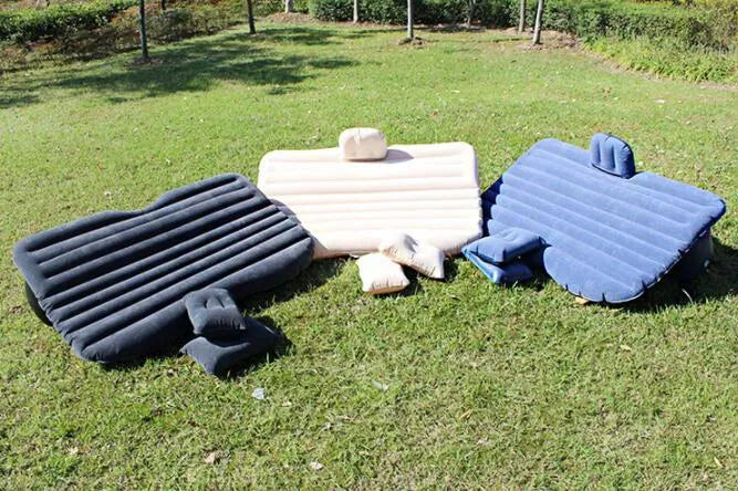 Ultra-thickened flocking cloth inflatable bed set up on a car rear seat with two pillows.