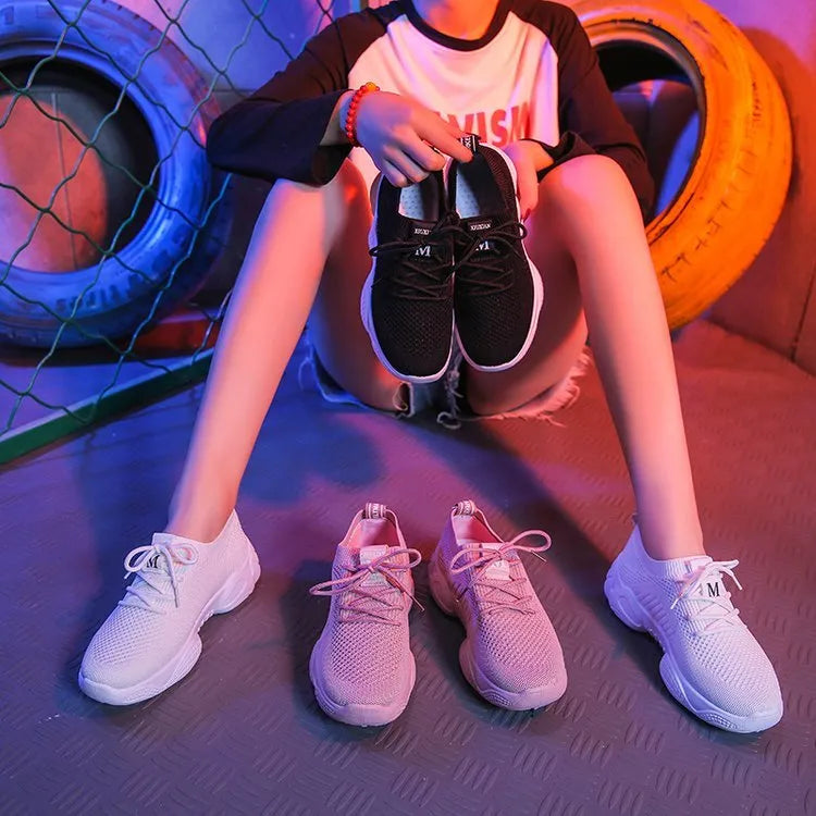 Women's white thick-soled sports shoes with woven upper, front strap, and rubber sole in multiple colour options