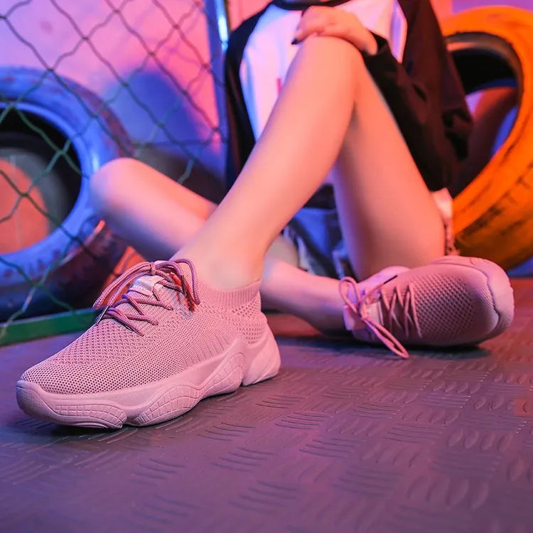 Women's white thick-soled sports shoes with woven upper, front strap, and rubber sole in multiple colour options