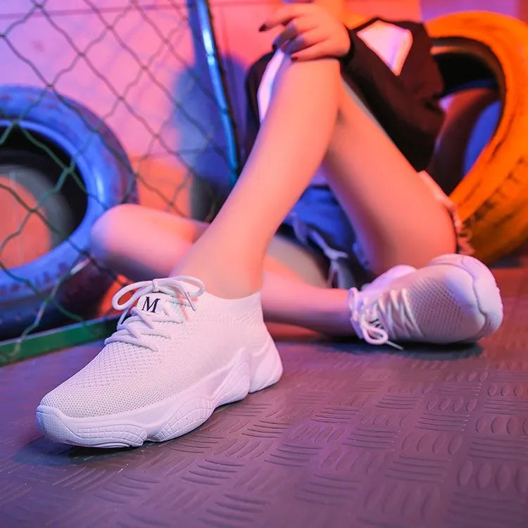 Women's white thick-soled sports shoes with woven upper, front strap, and rubber sole in multiple colour options