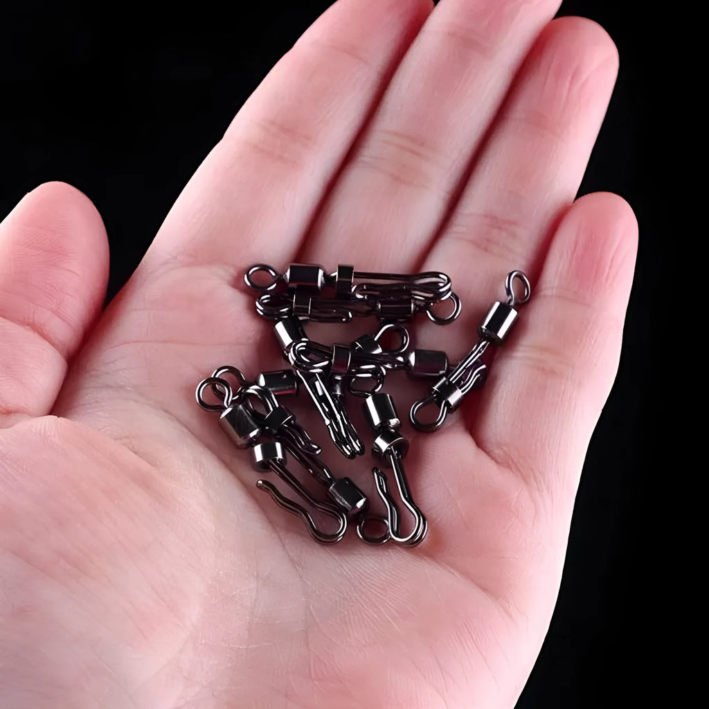Brass fishing barrel swivel with quick release clamp and 8-word ring, 5 pieces shown.
