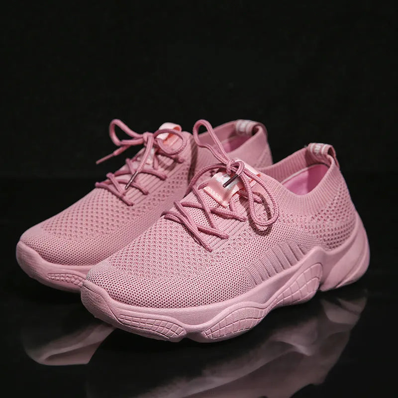 Women's white thick-soled sports shoes with woven upper, front strap, and rubber sole in multiple colour options