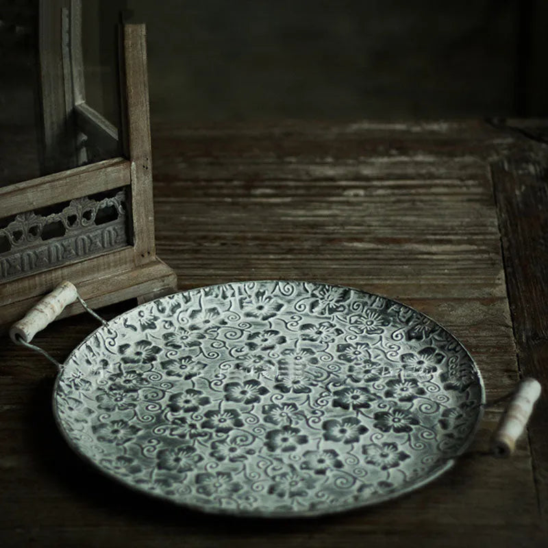 Round wrought iron storage tray in European style, shown in two available sizes for home organisation.