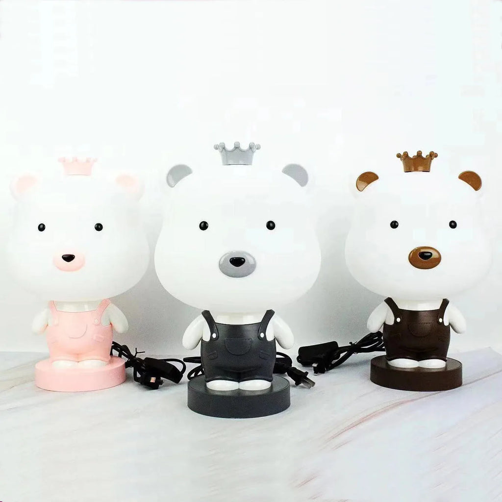 Cartoon-style animal table lamp with LED light in bear, cattle, rabbit, or tiger design on a table.