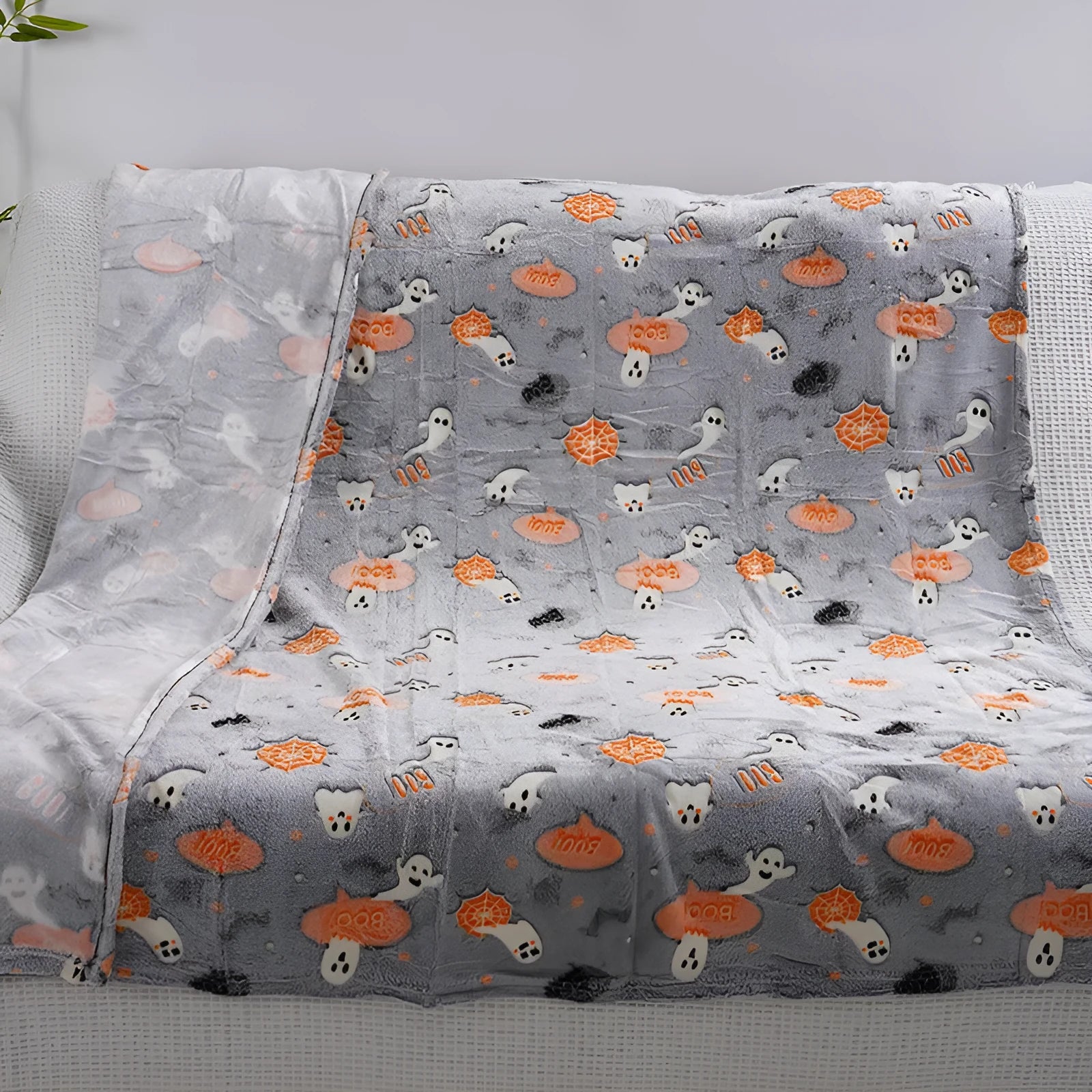 Cartoon-pattern flannel blanket laid flat, showing one of five colour options, suitable as a child's blanket or AC cover.