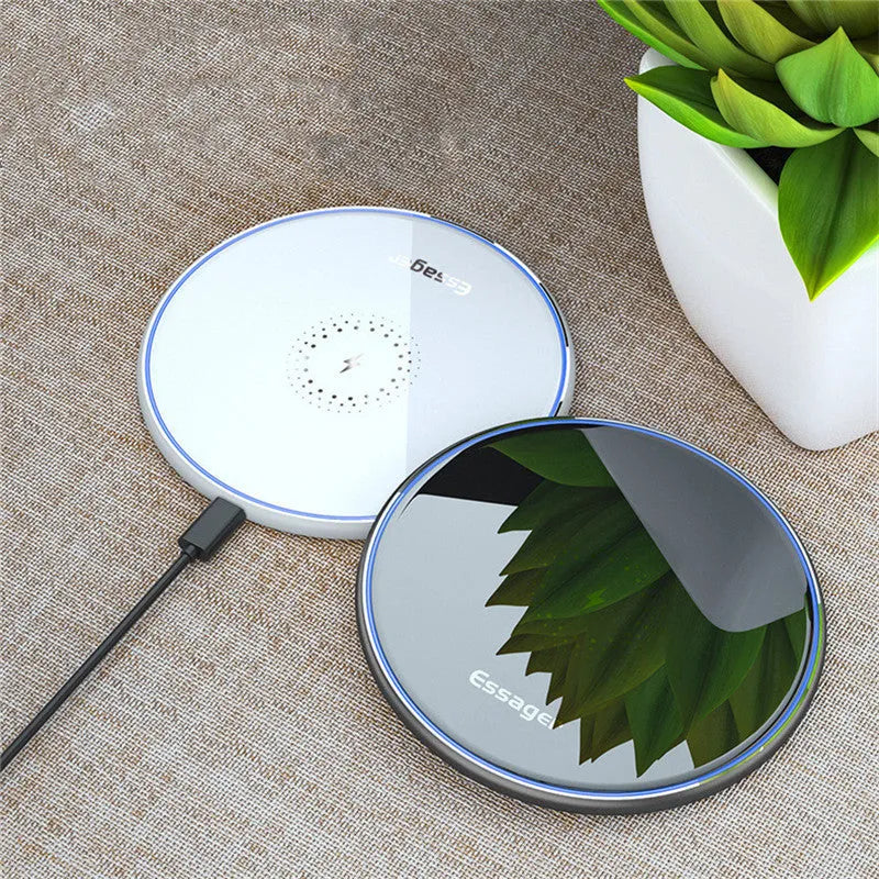 Black or white 15W Qi fast wireless charging pad with LED indicator light on anti-slip aluminium base.