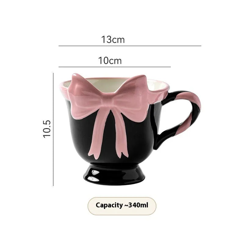 Heart-shaped ceramic mug with decorative bow design in white powder or black pink colour