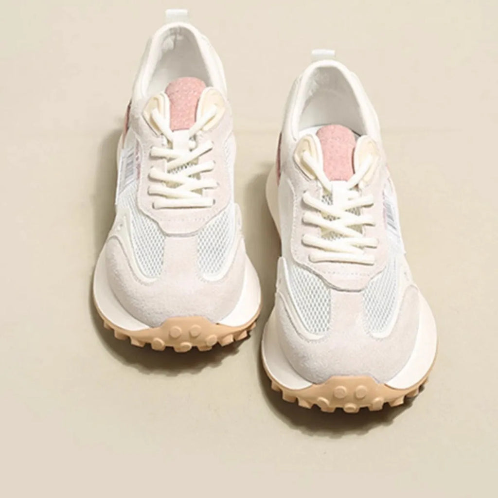 Women's grey and pink low-top retro sneakers with a round toe and flat rubber sole.