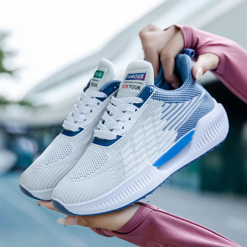 Men's blue casual mesh sports shoes with a round toe and cloth upper on a white background