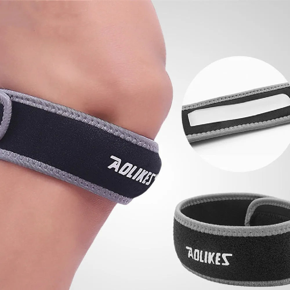 Black and grey adult patella retinaculum knee support for running and sports.