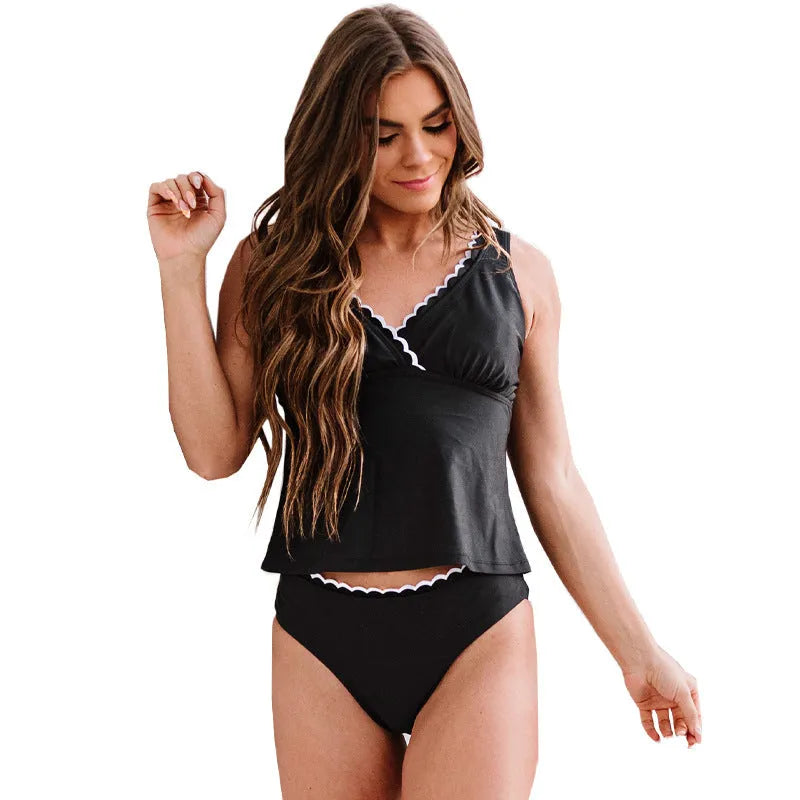 A black one-piece split swimsuit for women on a hanger, showing sleeveless design.