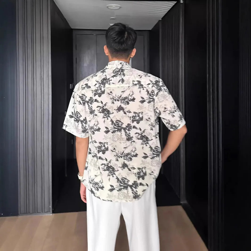 Men's black floral print short sleeve casual shirt with a loose fit and V-neck.