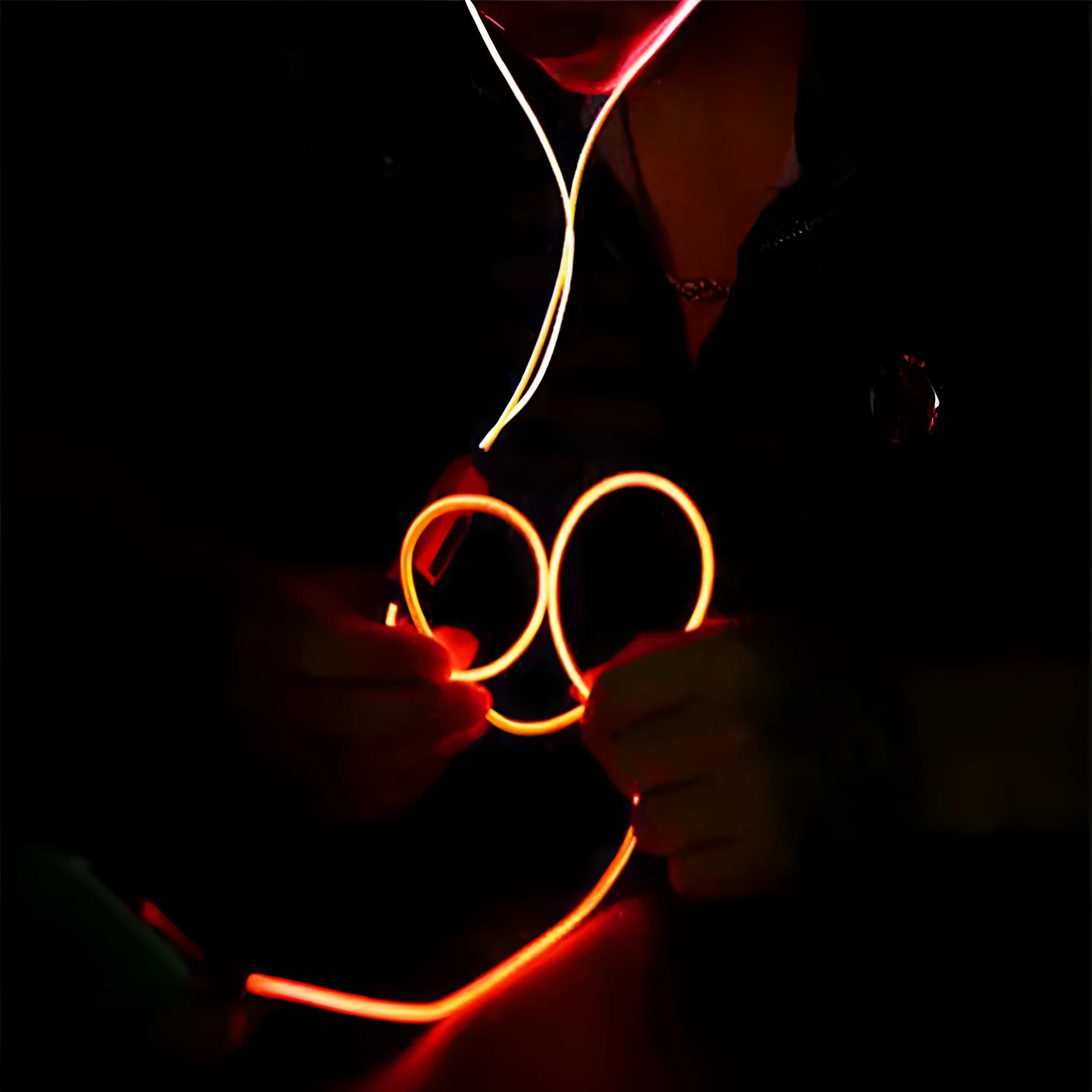 Blue Magic Light LED earphones with illuminated aluminium alloy shells showing EL light lines