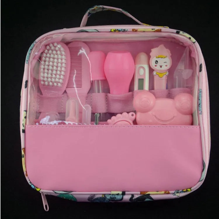 13-piece newborn baby care kit with pink grooming bag containing thermometer, scissors, brush, comb, nail clipper, and medicine tools