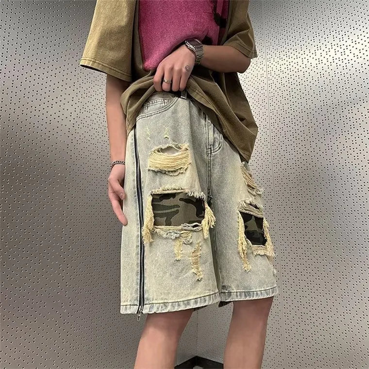 Men's camouflage pattern denim shorts with distressed rip detailing in yellow mud colour
