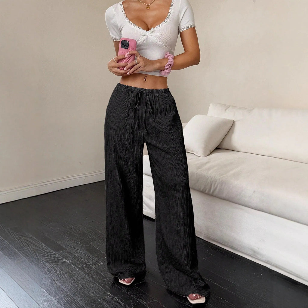 Women's wide-leg casual trousers with lace-up waist detailing in black or pink colour options